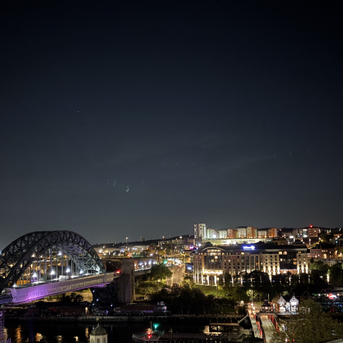 Aerial photo of Newcastle with Gateshead Bridge in the evening