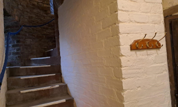 A freshly painted church wall and stair well