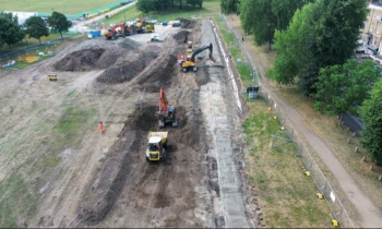 Construction work in a field with machinery