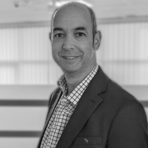 Headshot of James Worth in black and white