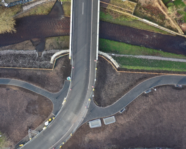 Birdseye view of the new road built over a river.
